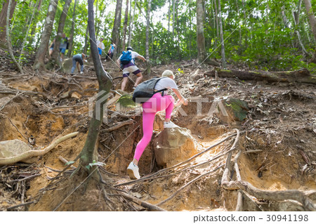 People Group With Backpacks Climb Mountain 30941198