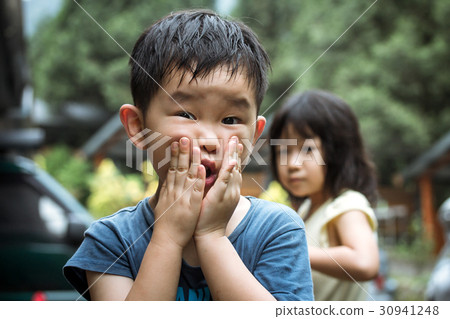 Little boy grimacing 30941248