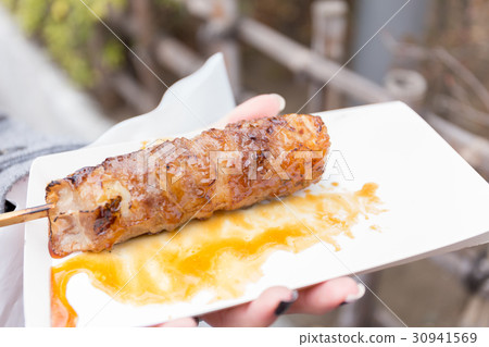 grilled beef wrapped rice with skewer wood stick grilled beef wrapped rice with skewer wood stick 30941569