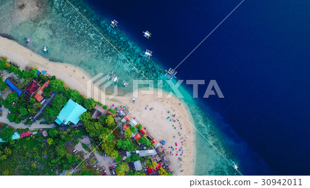 Aerial view of sandy beach with clear sea water. 30942011
