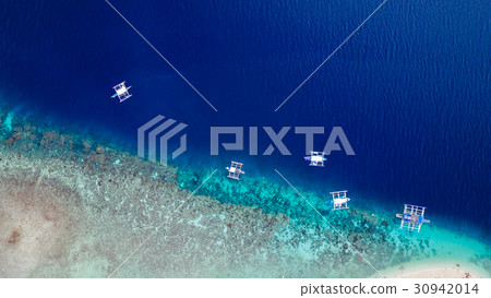 Aerial view of sandy beach with clear sea water. 30942014