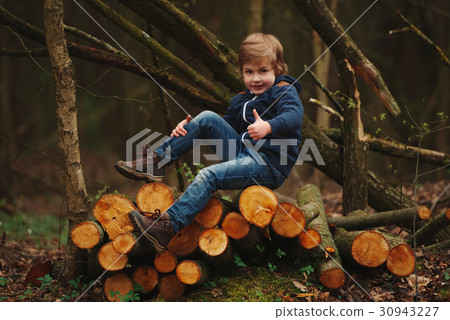 little sweet lumberjack in autumn forest 30943227