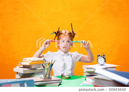 The Redhead teen girl with lot of books at home 30943640