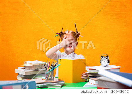 The Redhead teen girl with lot of books at home 30943642