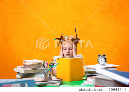 The Redhead teen girl with lot of books at home 30943644