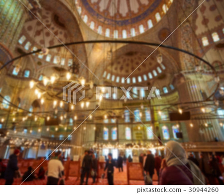 blur image of Muslims praying inside Mosque 30944260
