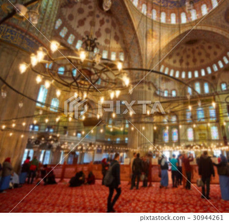 blur image of Muslims praying inside Mosque 30944261
