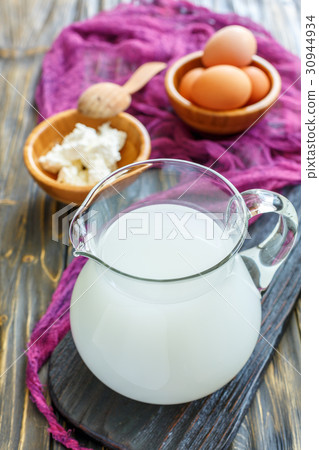 Homemade whey in a glass jar. 30944934