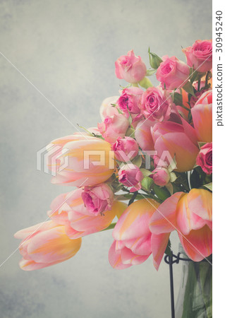 Pink and yellow tulips and roses 30945240