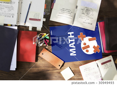 Aerial view of mathematics solution lessons on wooden table Aerial view of mathematics solution lessons on wooden table 30949493