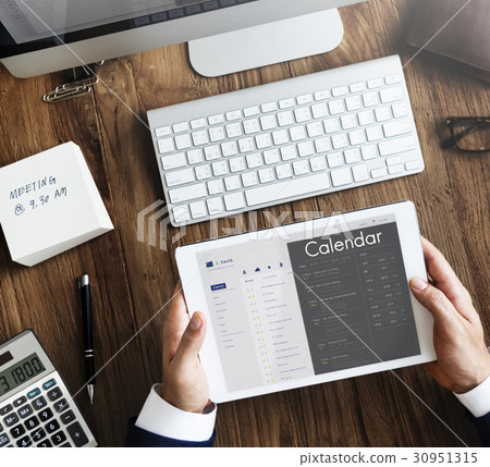 Business people checking appointment on personal organizer schedule 30951315