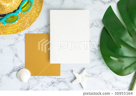 Blank white and gold paper card on marble table 30955164