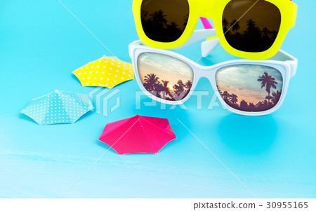 colorful sunglasses and parasol at studio 30955165