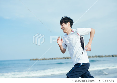 Men and women playing beach beach 30955285