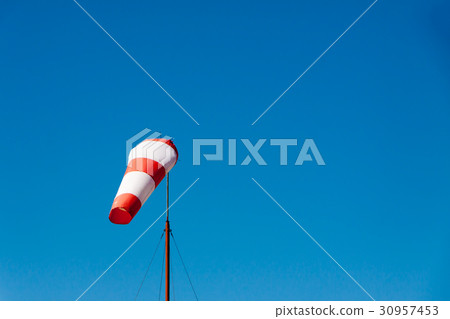 Airport windsock on clear blue sky background 30957453