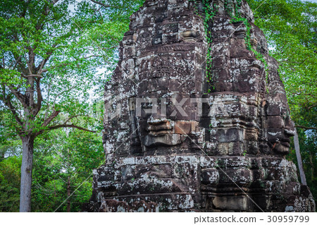 Ancient stone faces of Bayon temple, Angkor 30959799