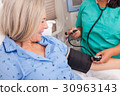 Senior Woman Hospital Blood Pressure Check  30963143