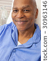 Senior African American Patient in Hospital Bed 30963146
