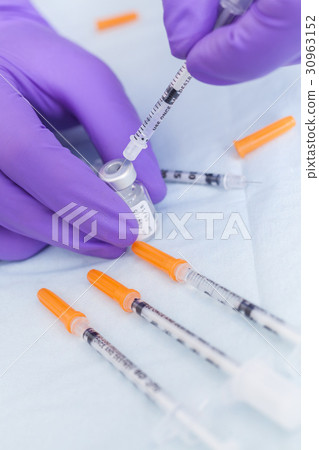 Cosmetic Surgeon Doctor Filling Botox Syringe Cosmetic Surgeon Doctor Filling Botox Syringe 30963152