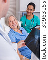 Happy Senior Woman Patient in Hospital Bed 30963155