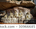Old buddha image on the rock. 30966685