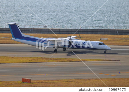 DHC 8-Q 400 during taxiing at Chubu International Airport DHC 8-Q 400 during taxiing at Chubu International Airport 30967675