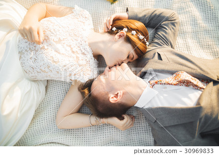 Close up portrait of couple against river and 30969833