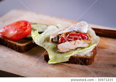 Cooking fresh homemade grilled tuna sandwich 30971835