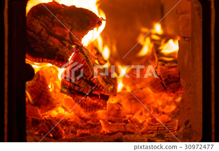 Fire and coals in fireplace furnace Fire and coals in fireplace furnace 30972477
