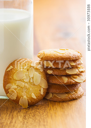 Sweet almond cookies with milk. Sweet almond cookies with milk. 30973886