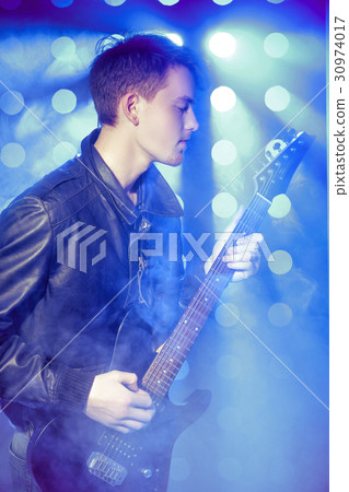 young attractive rock musician playing electric young attractive rock musician playing electric 30974017
