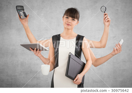 Multitask business woman with many hands. 30975642