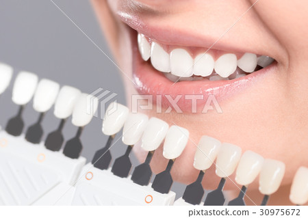 Beautiful smile and white teeth of a young woman. 30975672
