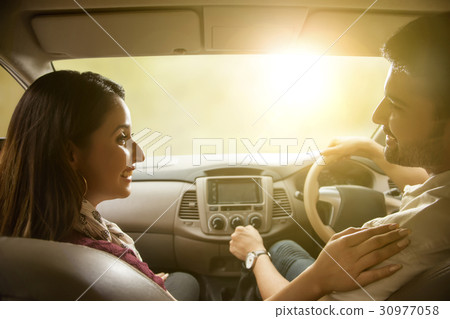 Young couple driving in car 30977058