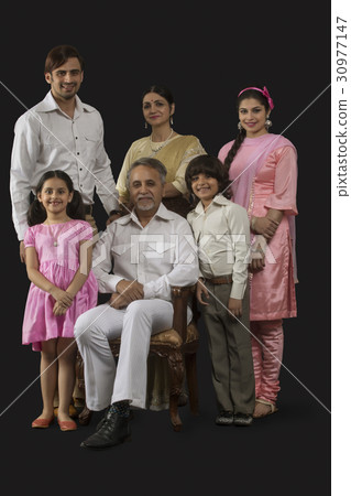 Portrait of smiling Indian multi-generation family dressed in retro style 30977147