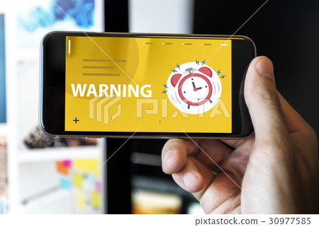 Hands with illustration of alarm clock notification for important appointment on mobile phone 30977585