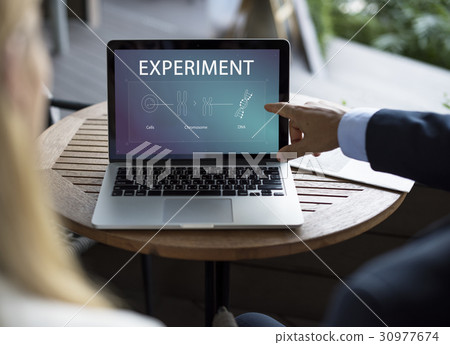 Business Man pointing at laptop with DNA icons Business Man pointing at laptop with DNA icons 30977674