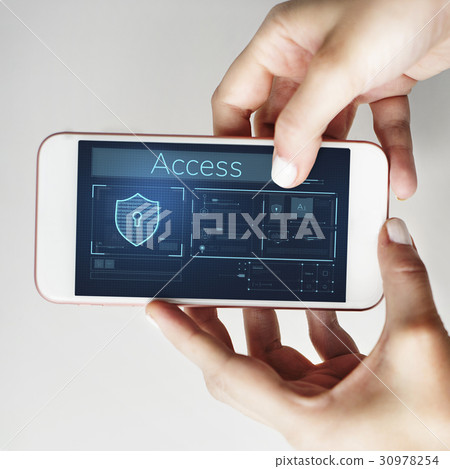 Hands working on digital device network graphic overlay 30978254