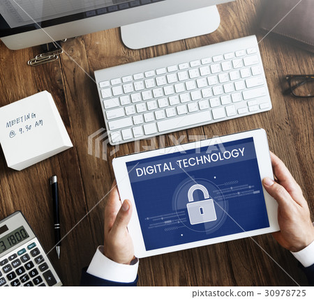 Hands working on digital device network graphic overlay 30978725