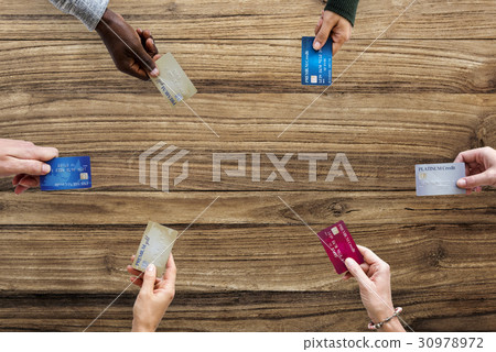Group of hands holding credit card convenience life with copy space in aerial view 30978972