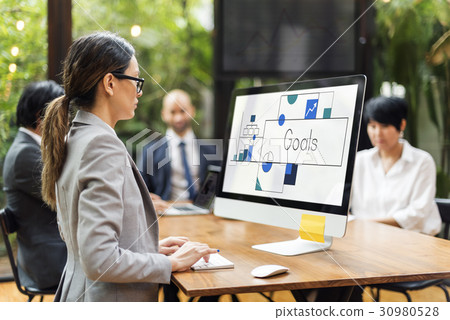 Woman working on computer network graphic overlay 30980528