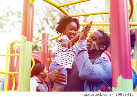 Happiness family holiday at playgorund Happiness family holiday at playgorund 30981415