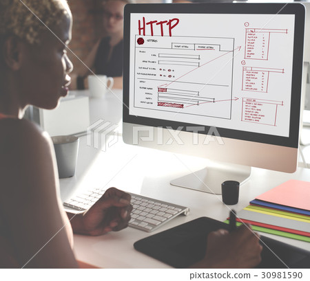 Woman working on computer network graphic overlay 30981590