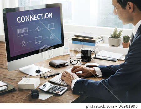 Man using computer cloud network graphic overlay Man using computer cloud network graphic overlay 30981995