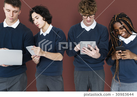 Group of Diverse High School Students Using Digital Devices Studio Portrait Group of Diverse High School Students Using Digital Devices Studio Portrait 30983644