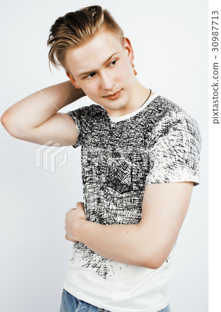 young handsome teenage hipster guy posing 30987713
