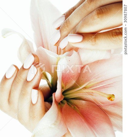 beauty delicate hands with manicure holding flower 30987807