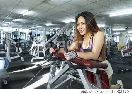 Fitness woman in training showing exercises 30988970