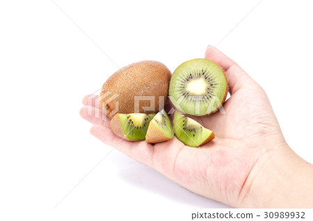 kiwi in hand on white background kiwi in hand on white background 30989932