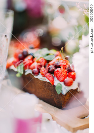 The blurred photo of the delicious fruit cake The blurred photo of the delicious fruit cake 30990049
